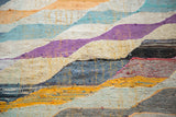 Dense texture and diagonal motif on a vintage Moroccan rag rug with vibrant hues.