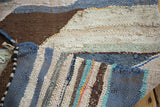 Textured vintage rag rug, dense recycled cotton weave with blue, ivory, and brown.