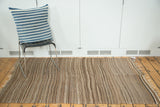 Vintage Moroccan Kilim featuring striated weaving in natural beige and brown tones.