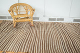 Vintage Moroccan Kilim rug with striped flatweave in natural brown and ivory tones.