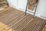 Natural undyed striated brown and ivory stripes on a vintage Moroccan Kilim flatweave.