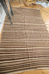 Striated undyed ivory, light coffee, and chocolate brown stripes on a vintage Moroccan Kilim.