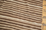 Striated ivory, light coffee, and chocolate brown stripes on a vintage Moroccan Kilim flatweave.