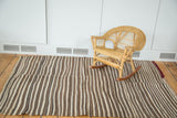 Striated Vintage Moroccan Kilim with natural striped tones and visible burgundy foundation.