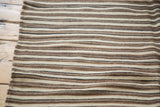 Textured vintage Moroccan Kilim flatweave with natural undyed ivory, light coffee, and charcoal stripes.