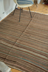 Striated weaving of vintage Moroccan Kilim rug in natural browns with subtle green.
