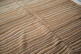 Striated natural brown and ivory tones on a vintage Moroccan Kilim flatweave rug.