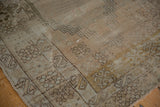Decorative distressed pile of a traditional Oushak prayer rug with bronze and faded blush tones.