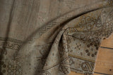 Distressed vintage Oushak rug border showing foundation with muted bronze and brown tones.