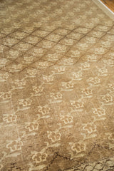 Vintage Oushak carpet detail revealing repeating floral design within subtle lattice, with warm abrashes.