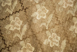 Hand-knotted vintage Oushak rug detail, showing repeating floral lattice and soft abrashes.