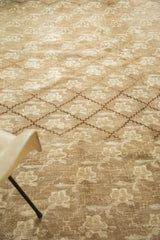 Vintage Oushak carpet with repeating beige floral lattice pattern and subtle abrashes.