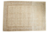 Vintage distressed Sivas carpet with a faded allover pattern on an ivory field and touches of cobalt blue.