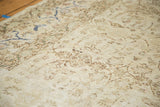 Distressed low-pile texture of the ivory vintage Sivas carpet with touches of cobalt blue.