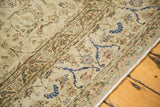Distressed ivory pile and cobalt blue floral border on a vintage hand-knotted Sivas carpet.