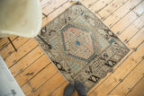 Vintage Oushak square rug featuring a quatrefoil medallion with diminutive teal diamond.