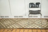 Geometric distressed checkered pattern of Oushak runner, with ivory, chocolate, and green tones.