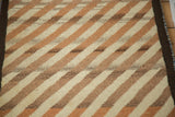 Traditional Gabbeh rug with thick plush pile, ivory, light copper, and brown diagonal stripes.