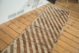 Traditional Qashqai Gabbeh runner with diagonal copper, ivory stripes, and blue animal motifs.