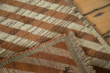 Plush brown and ivory diagonal striped pile of a vintage Gabbeh runner, showing hand-knotted foundation and fringe.