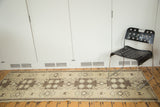 Tribal geometric pattern with starburst motifs in sand, beige, and shorn brown tones.