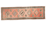 Vintage Oushak runner featuring hooked geometric pinwheel motifs on a faded cinnabar ground, 2'8