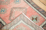Vintage Oushak runner corner, revealing hand knotted foundation and hooked geometric motifs.