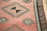 Oushak runner, geometric pinwheel gul motif, faded celadon, chocolate, and Greek key border.