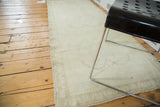 Soft texture and subtle inverted samovar motifs on a light blush vintage Oushak rug.