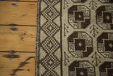 Secured side and intricate checkered diamond border of the vintage Konya rug.