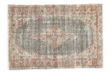 Vintage Oushak rug with faded brick red scalloped medallion, distressed chocolate field, 3'8