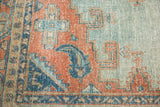 Distressed texture of vintage Oushak carpet, with sky blue and peachy blush patterns.