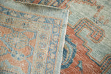 Distressed sky blue and peach Oushak pile, revealing hand-knotted weave on the rug back.