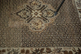 Vintage Oushak rug diamond medallion, pearl field, and brown and ivory border.