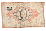Distressed vintage Oushak rug, faded cinnabar red field, charcoal floral medallion, 4'10