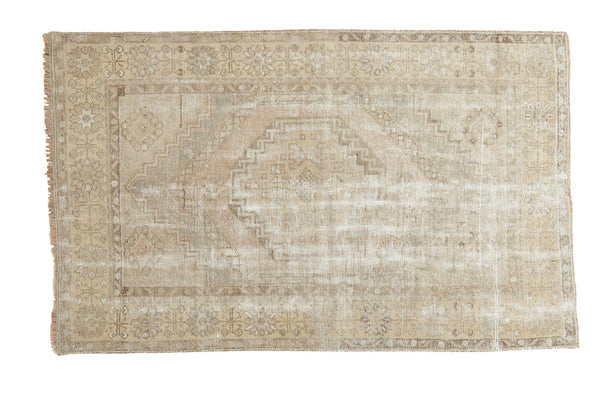 Vintage Oushak distressed rug, faded octagonal medallion, geometric borders, calm earth tones.