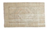 Vintage Oushak distressed rug, faded octagonal medallion, geometric borders, calm earth tones.