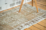 Distressed vintage Oushak runner revealing aged texture, visible foundation, and muted colors.