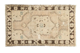 Distressed vintage Oushak rug, ornate medallion on ivory-blush field, chocolate brown border, 3'4