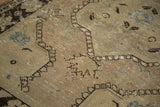 Distressed pile of the Vintage Oushak rug, highlighting ivory, dark brown, blush, and faded denim hues.
