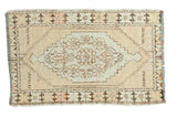 Vintage Oushak distressed rug, oblong stepped medallion, faded saffron, beige, brown. 2'7