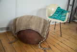 Hand loomed vintage grainbag, showcasing coarse speckled texture in natural ivory, grey, and brown goat hair.