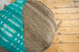 Speckled ivory, grey, and brown natural goat hair vintage grainbag texture, with teal fabric.