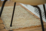 Faded saffron yellow, blush hand-knotted pile with original overcast end.