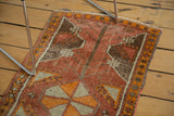 Distressed Oushak rug, madder red, tangerine, silver, brown floral motifs, side selvedge.