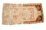Distressed vintage Oushak hand knotted runner with octagonal medallion, faded peach and orange.