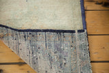Original dark blue side cord selvedge and hand-knotted foundation of the Oushak rug.