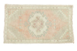 Vintage Oushak distressed rug with blush field, crab medallion, seafoam, and faded accents. 1'8