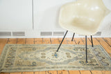 Vintage Oushak runner showcasing central lozenge medallion with sand, blue, and ivory tones.