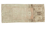 Vintage Oushak runner with faded ivory, sea foam, charcoal, and peach medallion.